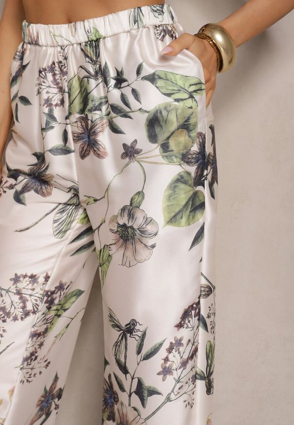 Renee - Beżowe Spodnie z Wiskozą o Szerokim Kroju High Waist w Kwiaty Davilsa. Okazja: na co dzień. Stan: podwyższony. Kolor: beżowy. Materiał: wiskoza. Wzór: kwiaty. Styl: casual