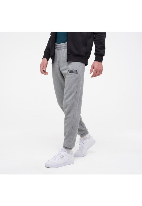 Spodnie dresowe męskie Puma Gym & Pilates.. Kolor: szary. Materiał: dresówka. Sport: joga i pilates