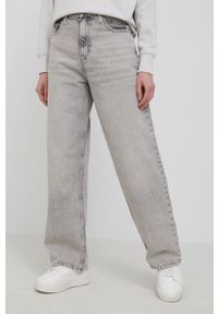 Calvin Klein Jeans Jeansy damskie high waist. Stan: podwyższony. Kolor: beżowy