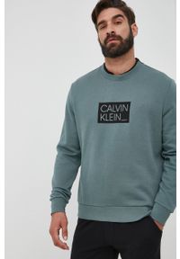 Calvin Klein bluza męska kolor zielony z aplikacją. Okazja: na co dzień. Kolor: zielony. Materiał: włókno. Wzór: aplikacja. Styl: casual