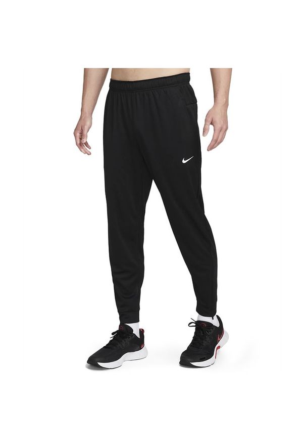 Spodnie Nike Totality FB7509-010 - czarne. Kolor: czarny. Materiał: materiał, poliester, skóra, dresówka. Technologia: Dri-Fit (Nike)