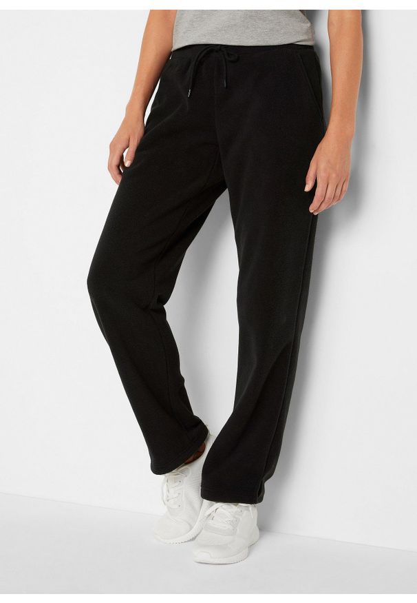 bonprix - Polarowe spodnie z elastyczną gumką w talii. Okazja: na co dzień. Kolor: czarny. Materiał: polar. Styl: casual