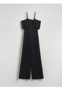 Reserved - Kombinezon z dekoracyjną falbaną - czarny. Kolor: czarny. Materiał: tkanina. Wzór: gładki. Typ sukienki: proste #1