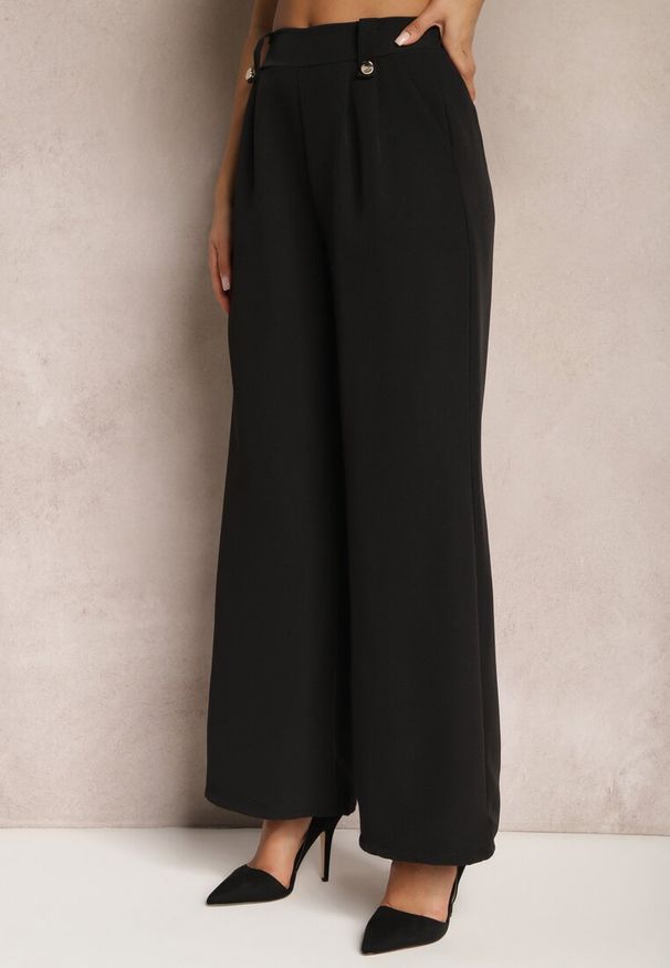 Renee - Czarne Eleganckie Spodnie Dzwony z Ozdobnymi Patkami w Pasie Nattas. Stan: podwyższony. Kolor: czarny. Styl: elegancki