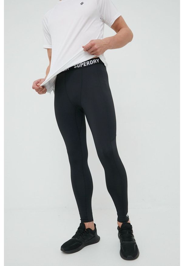 Superdry legginsy męskie kolor czarny gładkie. Kolor: czarny. Materiał: skóra, dzianina, materiał. Wzór: gładki