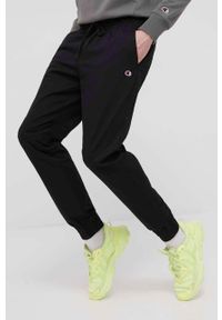Champion spodnie męskie kolor czarny joggery. Kolor: czarny. Materiał: włókno, tkanina