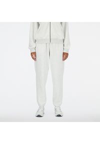 Spodnie damskie New Balance WP41500AHH – szare. Stan: podwyższony. Kolor: szary. Materiał: dresówka, bawełna, poliester