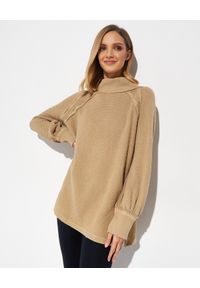 FREE PEOPLE - Beżowy sweter oversize. Kolor: beżowy