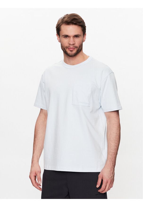 New Balance T-Shirt MT23567 Niebieski Relaxed Fit. Kolor: niebieski. Materiał: bawełna