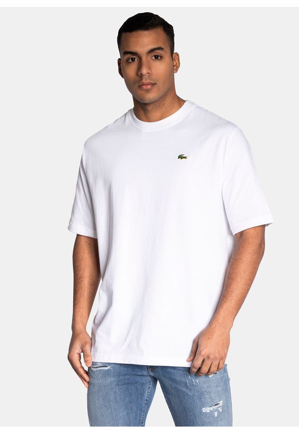 Koszulka męska biała Lacoste TH9162.001. Typ kołnierza: polo. Kolor: biały. Materiał: dzianina. Długość: krótkie. Sezon: lato. Sport: bieganie