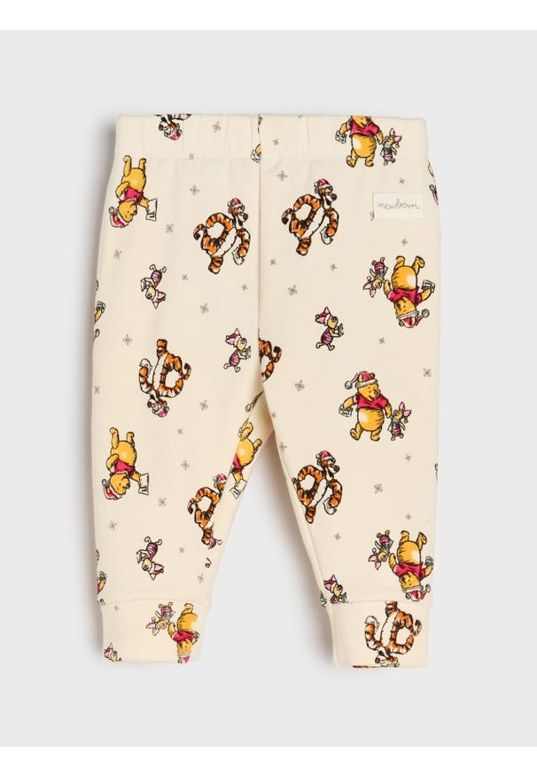 Sinsay - Spodnie z polarem w środku ze świątecznym motywem Winnie the Pooh - kremowy. Kolor: kremowy. Materiał: polar. Styl: wizytowy