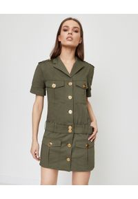 Balmain - BALMAIN - Sukienka mini w stylu militarnym. Okazja: do pracy. Kolor: zielony. Materiał: materiał. Wzór: moro. Styl: militarny. Długość: mini