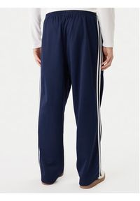 Adidas - adidas Spodnie dresowe adicolor KE3496 Granatowy Loose Fit. Kolor: niebieski. Materiał: bawełna #4