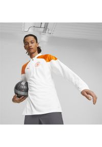 Puma - Top treningowy Manchester City 2023/24. Kolor: pomarańczowy, biały, wielokolorowy. Materiał: materiał. Sport: piłka nożna