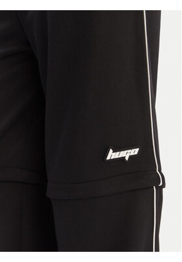 Hugo - HUGO Spodnie materiałowe Nateam 50554074 Czarny Regular Fit. Kolor: czarny. Materiał: syntetyk
