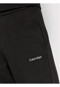 Calvin Klein Spodnie dresowe Micro Logo K10K109940 Czarny Relaxed Fit. Kolor: czarny. Materiał: dresówka, bawełna, syntetyk