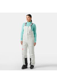 Damskie spodnie narciarskie cargo na szelkach Helly Hansen Switch. Kolor: zielony. Sezon: zima. Sport: narciarstwo #1