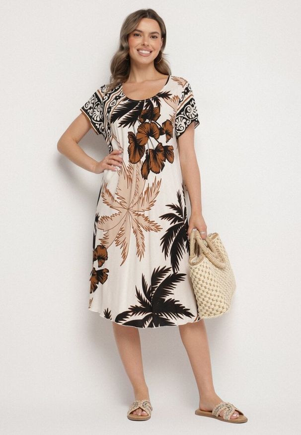 Born2be - Czarna Sukienka z Wiskozy o Rozkloszowanym Kroju w Roślinny Wzór Miratiela. Okazja: na co dzień. Kolor: czarny. Materiał: wiskoza. Długość rękawa: krótki rękaw. Sezon: wiosna, lato. Styl: casual, elegancki