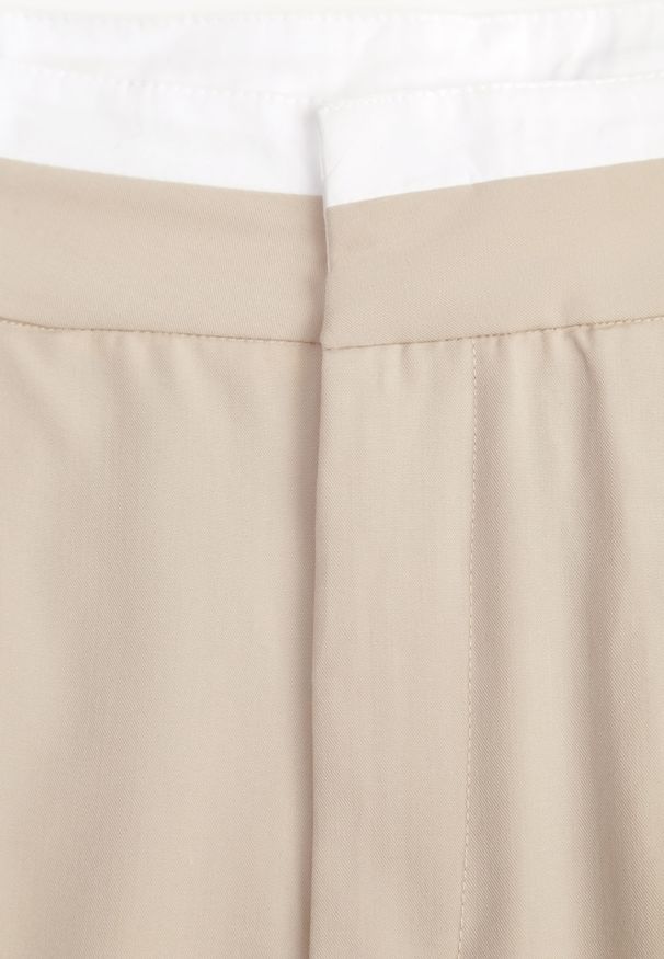 Renee - Beżowe Spodnie z Szerokimi Nogawkami w Kant Kavina. Okazja: na co dzień. Stan: podwyższony. Kolor: beżowy. Materiał: wiskoza. Styl: elegancki, casual, klasyczny