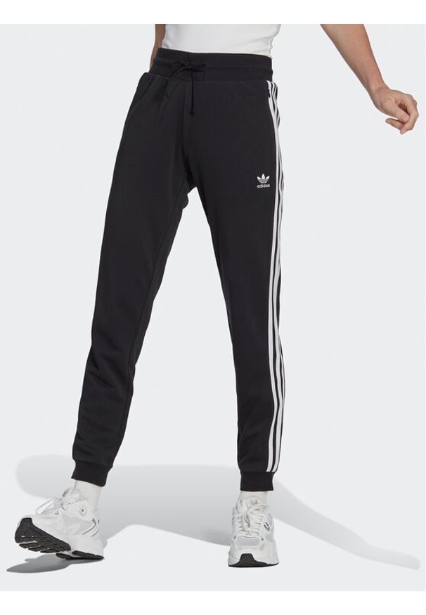 Adidas - adidas Spodnie dresowe Adicolor Classics Slim Cuffed Joggers IB7455 Czarny Slim Fit. Kolor: czarny. Materiał: bawełna