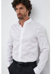 Armani Exchange koszula bawełniana męska kolor biały slim z kołnierzykiem klasycznym. Typ kołnierza: kołnierzyk klasyczny. Kolor: biały. Materiał: bawełna. Długość rękawa: długi rękaw. Długość: długie. Styl: klasyczny #1