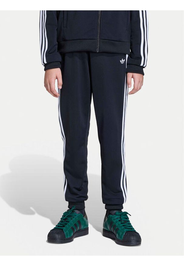 Adidas - adidas Spodnie dresowe adicolor SST KE2862 Czarny Regular Fit. Kolor: czarny. Materiał: syntetyk
