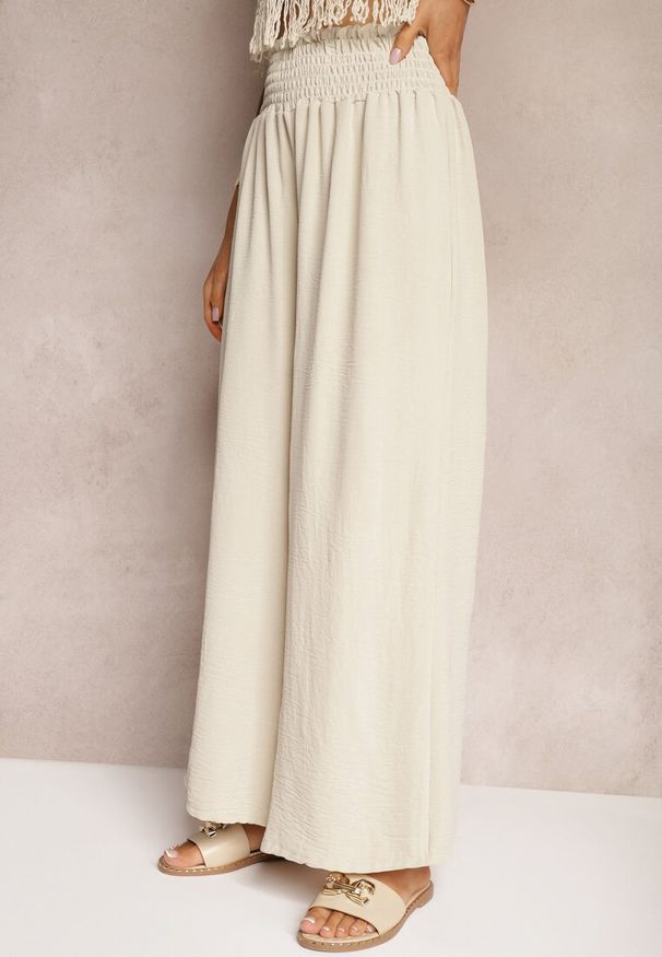 Renee - Beżowe Spodnie High Waist z Szerokimi Nogawkami i Gumką w Pasie Risabessa. Okazja: na co dzień. Stan: podwyższony. Kolor: beżowy. Styl: casual, elegancki