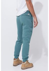 Spodnie męskie dresowe Carhartt Midweight Graphic Jogger. Kolor: zielony. Materiał: dresówka