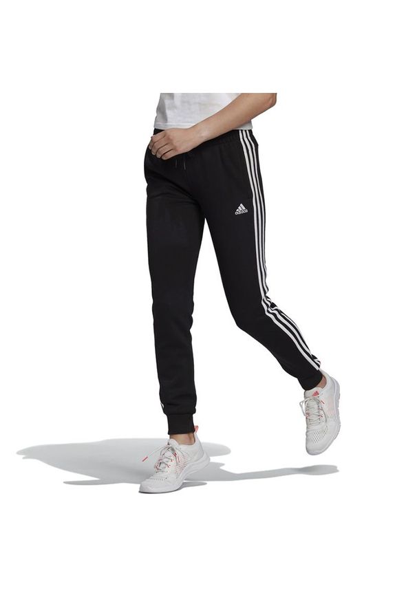 Adidas - Spodnie adidas Essentials French Terry 3-Stripes GM8733 - czarne. Kolor: czarny. Materiał: dresówka, bawełna, wiskoza, poliester. Wzór: paski. Sport: fitness