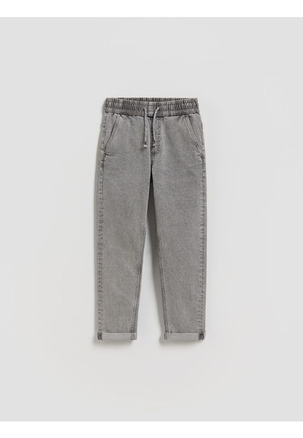 Reserved - Jeansy carrot fit - jasnoszary. Kolor: szary