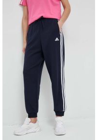 Adidas - adidas spodnie dresowe bawełniane kolor granatowy wzorzyste. Kolor: niebieski. Materiał: bawełna, dresówka #1