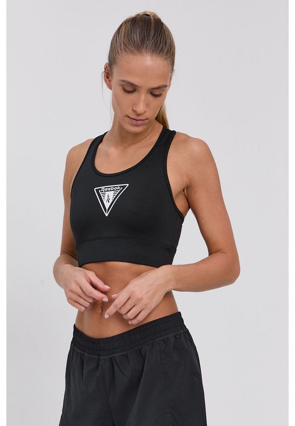 Reebok - Biustonosz sportowy. Kolor: czarny. Materiał: skóra. Wzór: nadruk