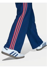Adidas - adidas Spodnie dresowe Firebird Double Knit KD7825 Granatowy Loose Fit. Kolor: niebieski. Materiał: syntetyk #6
