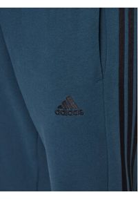 Adidas - adidas Spodnie dresowe Essentials French Terry Tapered Cuff 3-Stripes Joggers IJ8698 Turkusowy Regular Fit. Kolor: turkusowy. Materiał: bawełna, dresówka #4