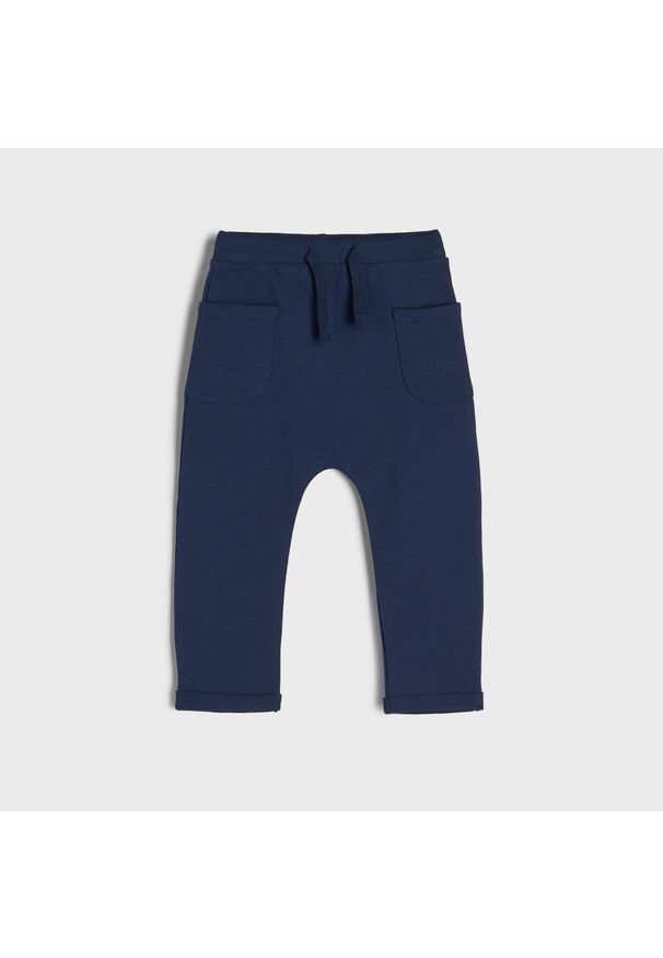 Sinsay - Spodnie dresowe - Granatowy. Kolor: niebieski. Materiał: dresówka