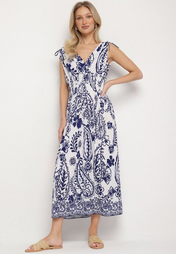 Born2be - Niebieska Sukienka z Roślinnym Wzorem i Kopertowym Dekoltem z Gumką w Talii Orrune. Okazja: do pracy, na co dzień, na spotkanie biznesowe. Typ kołnierza: dekolt kopertowy. Kolor: niebieski. Materiał: jeans. Sezon: lato. Typ sukienki: kopertowe. Styl: casual, klasyczny, biznesowy