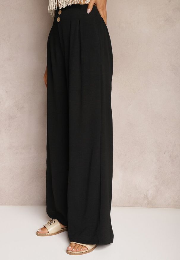 Renee - Czarne Spodnie w Stylu Alladynek High Waist Wykończone Gumką w Pasie Riselma. Okazja: na co dzień. Stan: podwyższony. Kolor: czarny. Styl: casual, sportowy