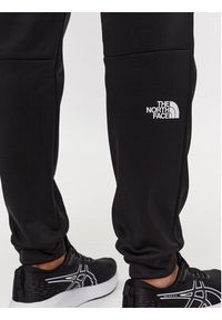 The North Face Spodnie dresowe Reaxion NF0A7Z9P Czarny Regular Fit. Kolor: czarny. Materiał: syntetyk #3