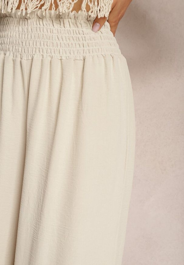 Renee - Beżowe Spodnie High Waist z Szerokimi Nogawkami i Gumką w Pasie Risabessa. Okazja: na co dzień. Stan: podwyższony. Kolor: beżowy. Styl: casual, elegancki