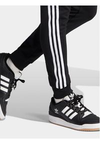 Adidas - adidas Spodnie dresowe adicolor Classics SST IL2488 Czarny Slim Fit. Kolor: czarny. Materiał: bawełna, syntetyk