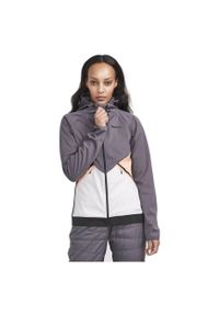 Damska wiatrówka z kapturem Craft Glide. Typ kołnierza: kaptur. Kolor: szary. Materiał: softshell. Sport: turystyka piesza