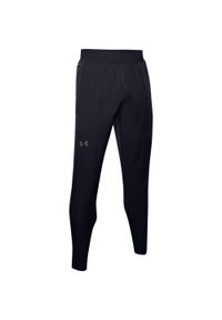 Spodnie dresowe slim fit Under Armour Flex Woven. Kolor: czarny, szary, wielokolorowy. Materiał: dresówka. Sport: fitness