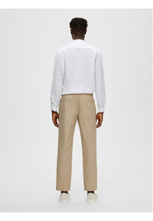 Selected Homme Chinosy 16088515 Beżowy Regular Fit. Kolor: beżowy. Materiał: bawełna