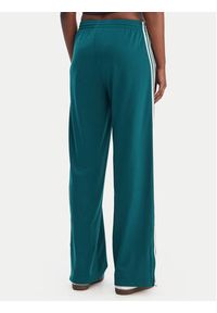 Adidas - adidas Spodnie dresowe Firebird KG3701 Zielony Loose Fit. Kolor: zielony. Materiał: syntetyk #4