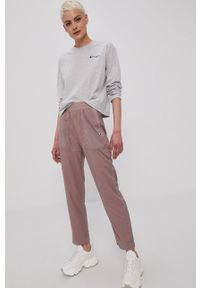 Champion Spodnie 113801 damskie kolor różowy. Kolor: różowy. Materiał: tkanina. Wzór: gładki