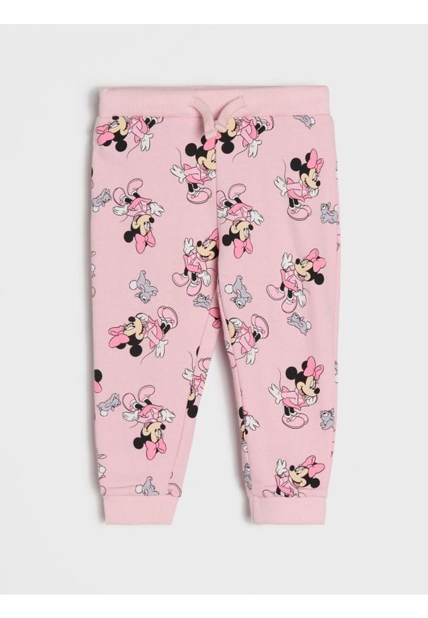 Sinsay - Spodnie dresowe jogger ze wzorem Minnie Mouse - różowy. Kolor: różowy. Materiał: dresówka. Wzór: motyw z bajki