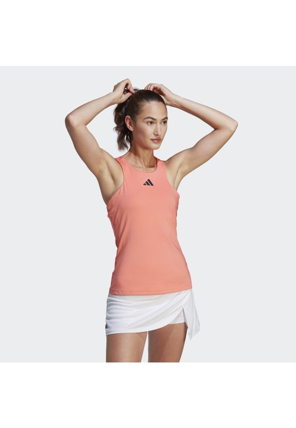 Adidas - Damski tank top adidas Y-Tank Coral Fusion. Kolor: pomarańczowy. Materiał: materiał. Długość rękawa: bez rękawów