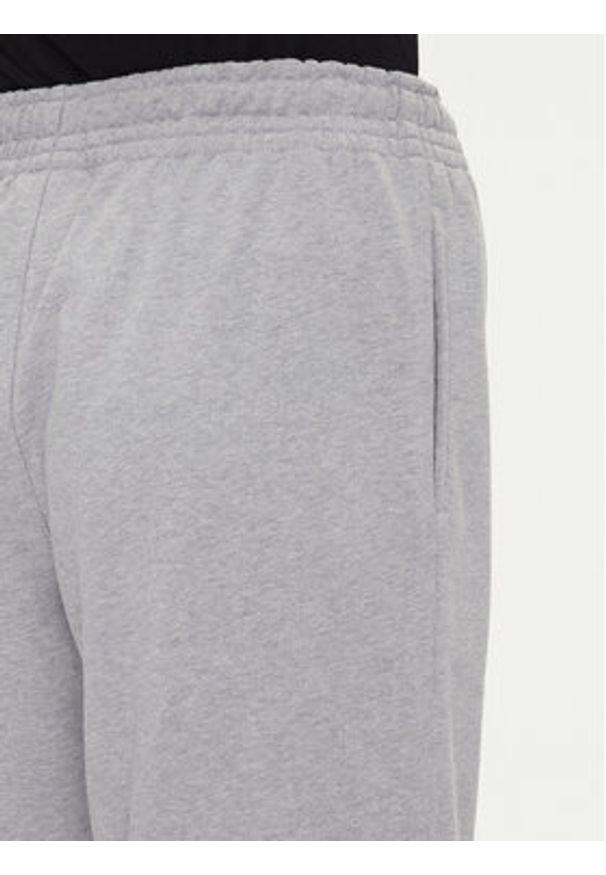 Calvin Klein Jeans Spodnie dresowe Monologo LV047B235G Szary Regular Fit. Kolor: szary. Materiał: bawełna