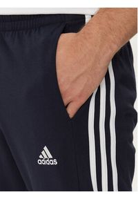 Adidas - adidas Spodnie dresowe Essentials IC0045 Granatowy Regular Fit. Kolor: niebieski. Materiał: bawełna, syntetyk #3
