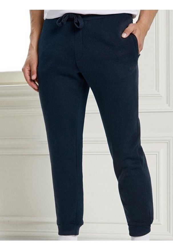 Sinsay - Spodnie dresowe jogger - granatowy. Kolor: niebieski. Materiał: dresówka